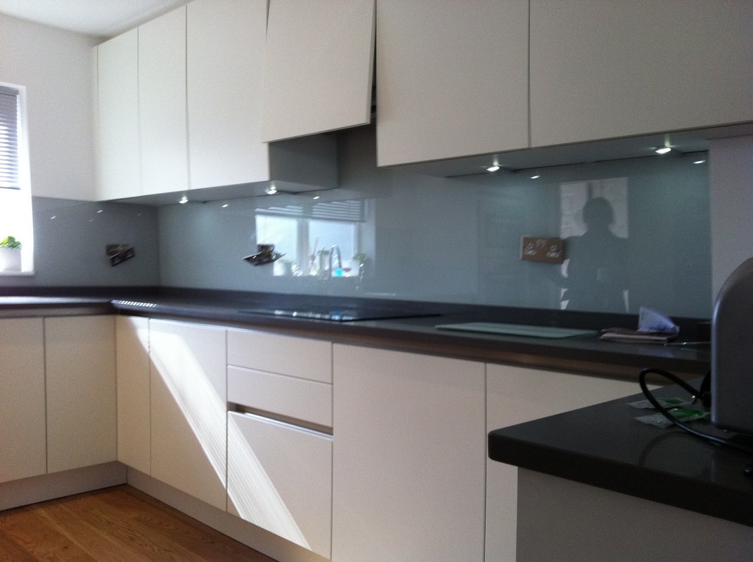 Grey glass kitchen splashback with LED lighting in Tring
